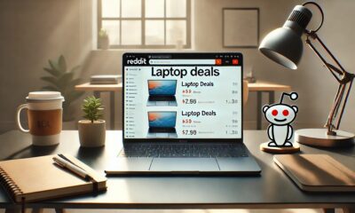 A laptop placed on a modern desk with Reddit open on the screen, surrounded by notebooks and coffee.