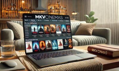 mkvcinemas homepage displaying movie options and download links on a digital device in a minimalist setup.